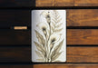 a picture of a white flower on a wooden bench