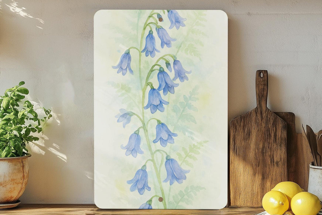 a painting of bluebells on a wall next to a cutting board