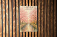 a picture of a book on a wooden wall