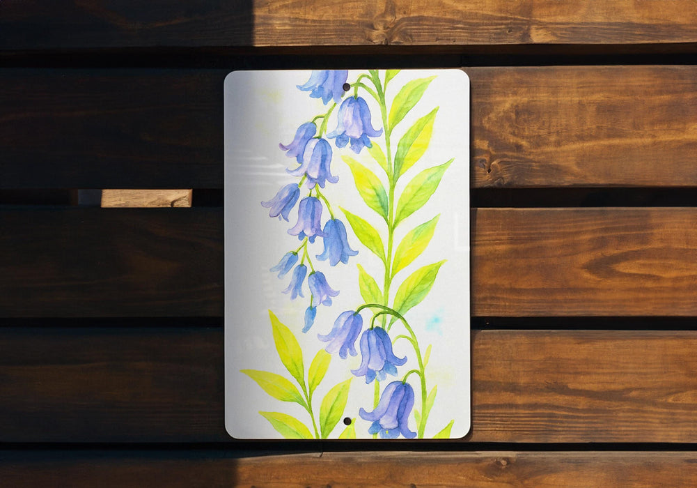 a painting of blue flowers on a white plate