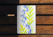 a painting of blue flowers on a white plate