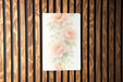 a picture of flowers on a wooden wall