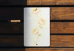 a picture of flowers painted on the side of a wooden bench