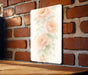 a picture of some flowers on a brick wall