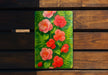 a painting of red flowers on a green background