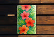 a painting of red and orange flowers on a wooden bench