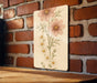 a picture of some flowers on a brick wall