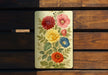 a wooden bench with a flower painted on it