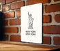 a new york sign on a brick wall