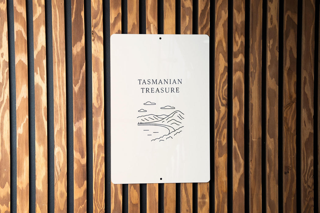 a sign on the side of a wooden wall