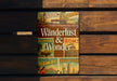 a book sitting on top of a wooden bench