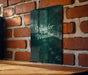 a wooden table sitting next to a brick wall