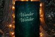 a sign that reads wander in wonder in front of a tree