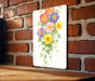 a picture of a bunch of flowers on a wall