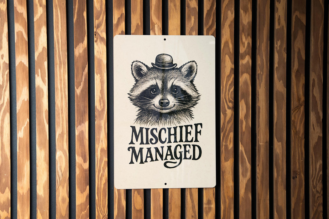 a raccoon sticker on a wooden wall