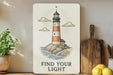 a picture of a light house on a shelf