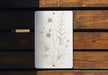 a picture of some flowers on a wooden bench