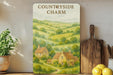 a picture of a country side charm hanging on a wall