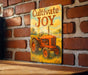 a painting of a tractor on a brick wall