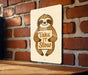 a sign that says take it slow on a brick wall