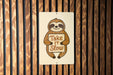 a sign that says take it slow on a wooden wall
