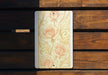a wooden bench with a painting of roses on it