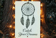 a sign that says catch your dreams on a tree