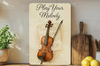 a picture of a violin on a shelf