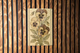 a painting of flowers on a wooden wall