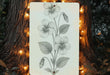 a picture of a flower on a tree with a string of lights around it