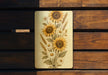 a picture of sunflowers on a wooden bench