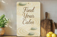 a wooden sign that says find your calm