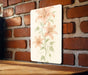 a picture of some flowers on a brick wall