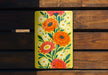 a yellow and red flower painted on a wooden bench
