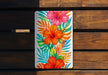 a painting of flowers on a wooden bench