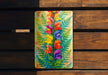 a painting of flowers on a wooden bench