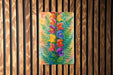 a painting of flowers on a wooden wall