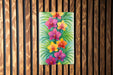a painting of flowers on a wooden wall