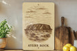 a picture of ayers rock on a shelf
