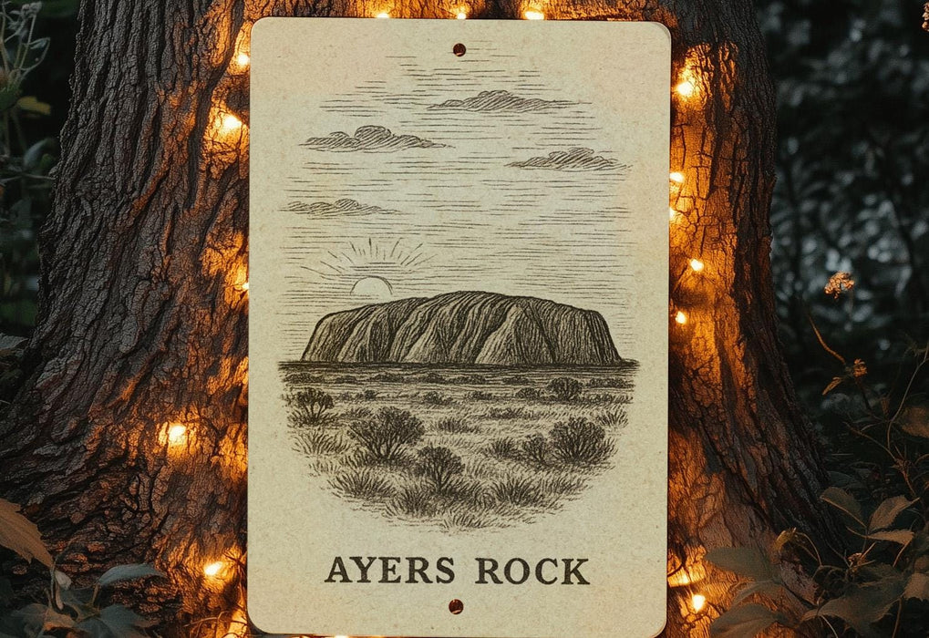 a picture of ayes rock on a tree with a string of lights