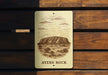 a wooden bench with a sign that says ayers rock