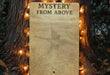 a sign on a tree that says mystery from above