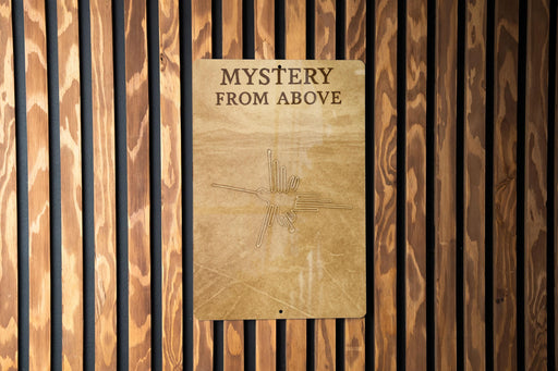 a sign on a wooden wall that says mystery from above