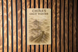 a sign on a wooden wall that says china's great wonder