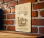 a picture of a sign on a brick wall