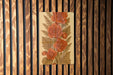a picture of some flowers on a wooden wall