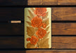 a close up of a wooden bench with a painting on it