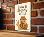 a sign that says slow and steady wins on a brick wall