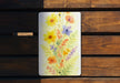 a picture of flowers painted on a piece of wood