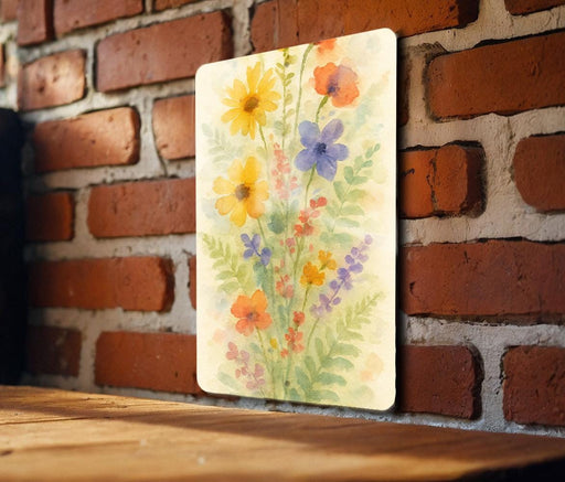 a painting of flowers on a brick wall